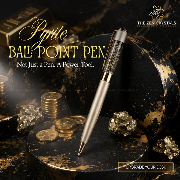 Pyrite ballpoint pen with gold coins and crystals on a dark surface, featuring The Zen Crystals brand.