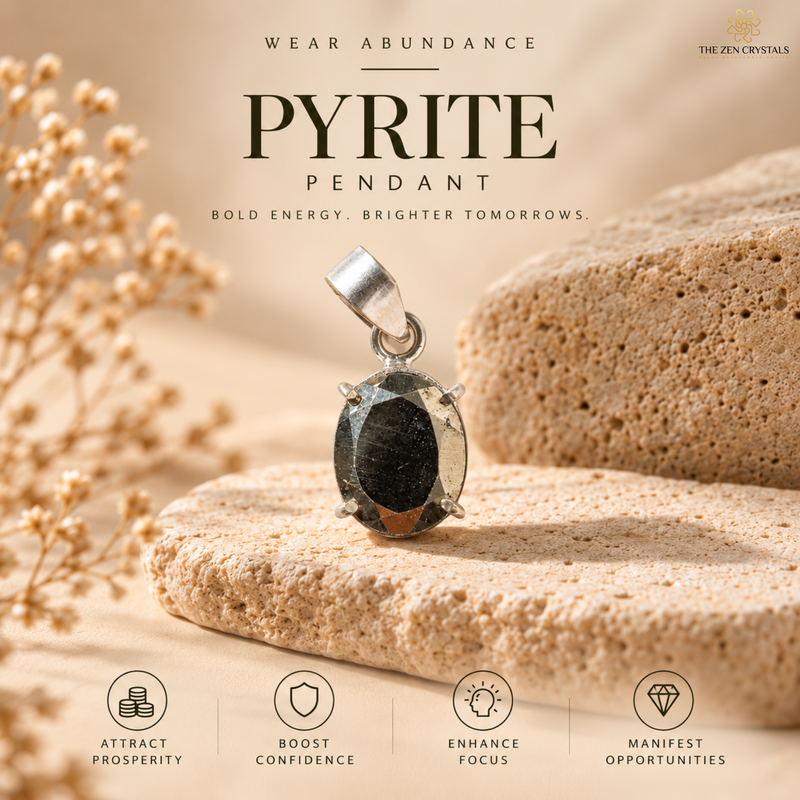 Pyrite pendant jewelry by The Zen Crystals, featuring a faceted dark metallic pyrite gemstone in a silver bezel setting, displayed on textured sandstone stones with dried flowers against a warm beige background with promotional text.