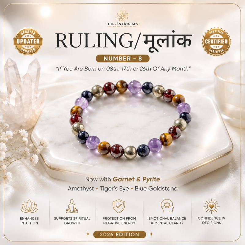A 2026 Edition Ruling (Number 8) gemstone bracelet by The Crystal Zen, displayed on a white marble hexagonal tray. The bracelet features a multicolor sequence of polished gemstone beads including purple, brown, gold, and red.