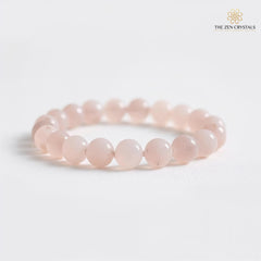 Rose quartz bracelet on a white background with 'The Zen Crystals' logo.