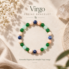 A beaded stretch bracelet for Virgo, featuring green, light blue, peach, cream, and dark blue polished gemstone-like beads, displayed on a textured beige background with decorative crystals and dried flowers.