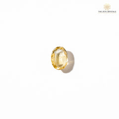 Yellow citrine crystal on a white background with 'The Zen Crystals' logo.