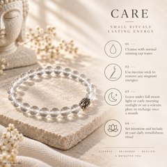 A clear crystal bracelet with a small black and gold bead charm rests on a textured stone slab. The image includes a 'CARE' guide with text and icons about how to maintain the bracelet, set against a warm, softly lit background with dried flowers.