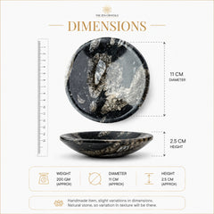 A product dimension infographic for a polished black and white stone bowl. The image shows the bowl from two angles, with a ruler on the left for scale and dimension lines indicating a diameter of 11 cm and a height of 2.