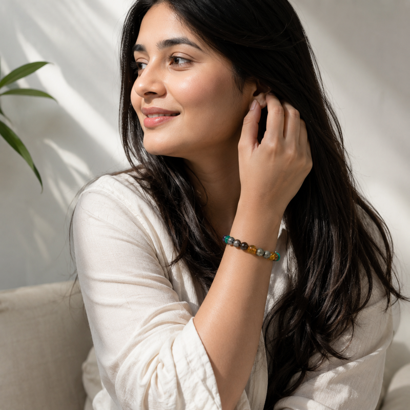 a woman wearing money magnet bracelet by the zen crystals
