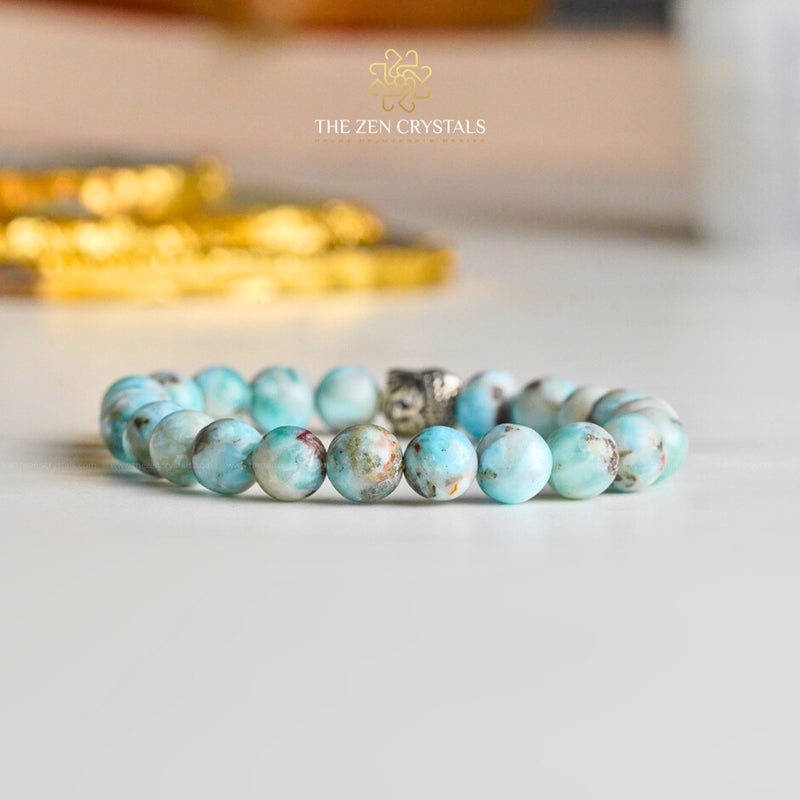 original larimar bracelet with silver clasp on a light background, branded 'The Zen Crystals'.